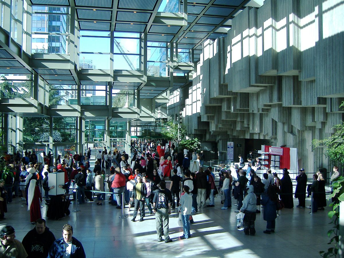 Inner lobby of the Seattle Convention Center with a crowd of people.