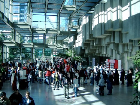 Inside view of the Seattle Convention Seattle with a crowd of people in the entrance.
